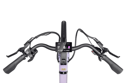 A sleek Velotric Breeze 1 eBike in a side view, showcasing its modern frame, integrated battery, and upright handlebars against a plain background.