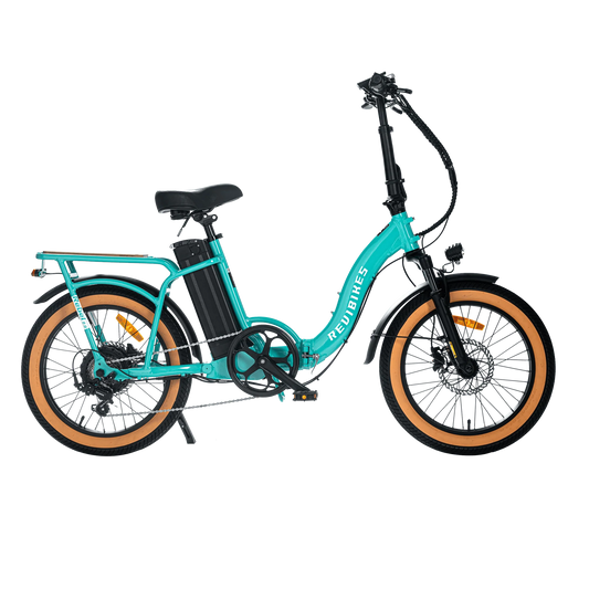 A white REVI Rebel 2 750w step-thru electric folding bike with 20x3 fat tires, shown from the side against a plain background.