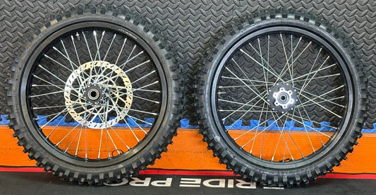 eMoto CST Knobby 19"/19" front and rear wheel and tire set for eMoto electric dirt bikes, offering superior traction and durability for off-road riding and adventure-ready performance.