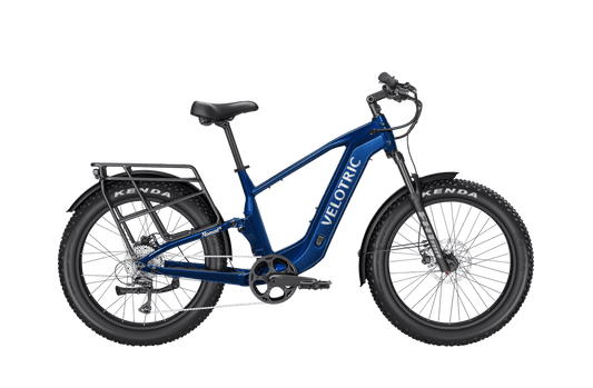 Royal blue Velotric Nomad 2X High Step eBike, side view, against a plain background