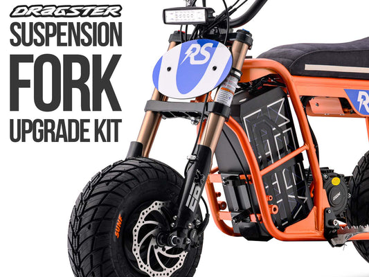 Stomp Ebox Dragster RS Suspension Upgrade Kit components displayed on a white background, including shock absorbers, mounting hardware, and springs.