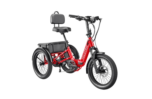 A cherry crimson Velotric Triker eTrike shown from the side, highlighting its three-wheel design and modern frame.