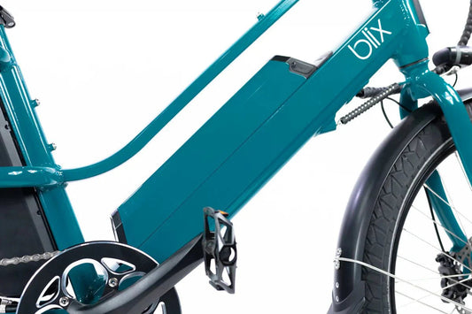 Blix Packa Genie Step-Thru 750W electric cargo eBike in white, shown with rear cargo rack and front basket, side view.