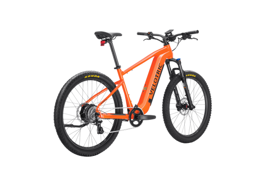 Velotric Summit 1 electric mountain bike in Sunrise Orange, side view, displayed against a white background.