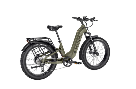 Velotric Nomad 2X eBike in Sage color, side view, showcasing its sturdy frame, wide tires, and integrated battery.