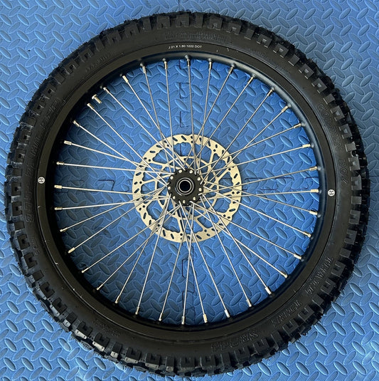 eMoto Shinko 244 Dual Sport 21" front wheel and tire set for eMoto bikes, offering exceptional handling, traction, and durability for off-road and on-road riding, built to tackle challenging terrains with ease.