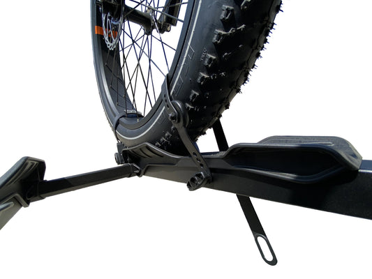 A close-up view of the Destination E Ratchet Strap Extension Kit for eBike racks, showing the black ratchet strap and metal hook components.