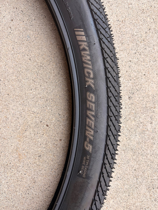 Product image of a Kenda Kwick Seven.5 eBike tire, size 27.5x2.20, showing tread pattern and sidewall branding.