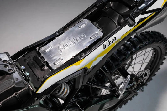SurRon Ultra Bee 2024 electric dirt bike in black and yellow, side view, displayed on a white background.