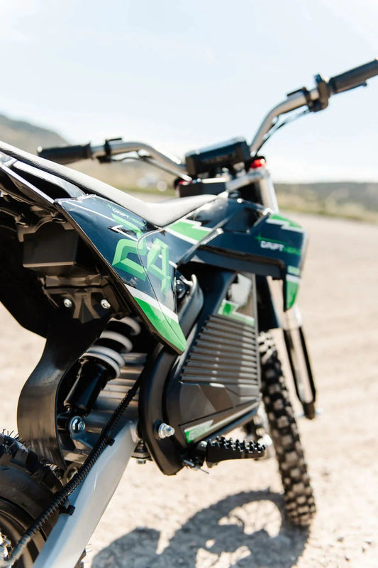 A black eMOTO eBike Drift Hero 2500w dirt bike with rugged tires, sturdy frame, and front suspension, displayed on a white background.