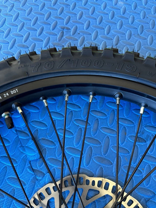 Product image of the eMOTO Surron eMoto Wheel Set featuring a CST knobby 19-inch front wheel and tire set for electric dirt bikes, shown without rotor or sprocket.