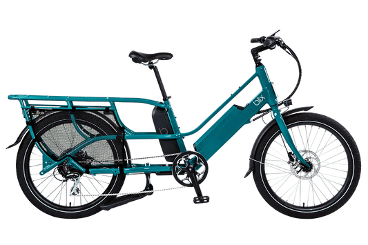 Teal Blix Packa Genie Step-Thru electric cargo eBike with 750W motor, shown from the side with cargo rack attached