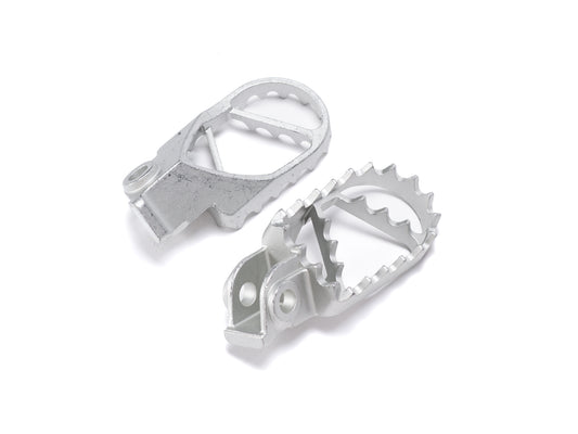 Stomp Ebox Dragster stainless steel foot pegs, angled view showing textured surface and mounting bracket.