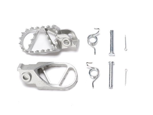 Stomp Ebox Dragster stainless steel foot pegs displayed on a white background, showing their textured surface and mounting brackets.