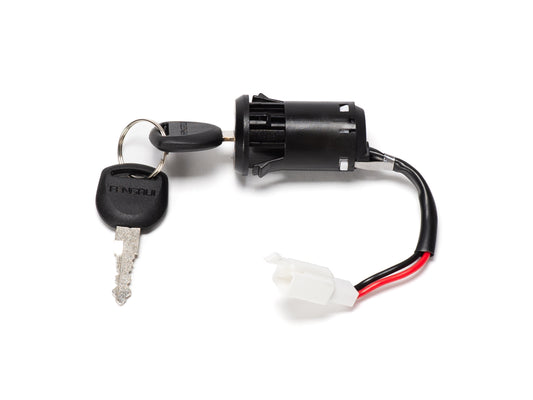 Close-up view of the Stomp Ebox ignition barrel and key, showing the metal ignition barrel with attached wiring and a single black plastic key.